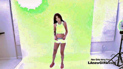 Hot Asian teen in yellow tank top and shorts for POV footjob casting