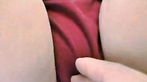 Japanese babe's close-up ass with red panties pulled aside, finger teasing for squirting pee play