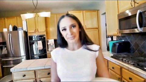 Brunette MILF in tight white top teasing with cleavage in sunny kitchen POV