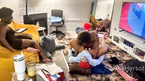 Naked black stud fucks redhead pussy missionary on living room rug while sexy ebony watches from couch