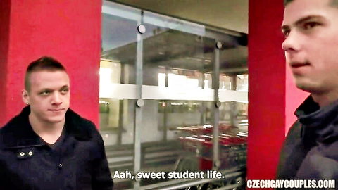 Two handsome Czech gay guys chatting in supermarket aisle during sweet student life