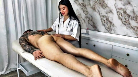 Latina masseuse in white uniform gropes tattooed man's bare ass during nude massage