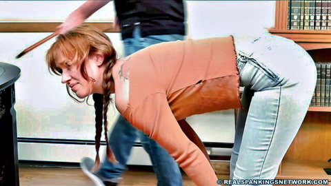Young Cara bent over, jeans down for humiliating spanking by principal