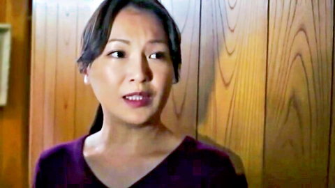 Seductive Japanese MILF in purple top, ponytail, intense gaze