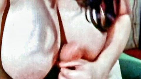 Kinky 1970s German babe with massive pale tits exposed in close-up