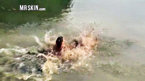 Roxanne and Holly diving into pool, wet bodies splashing in nude scene