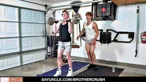 Fit stepbrothers lift weights in garage gym wearing tight shorts bulging muscles