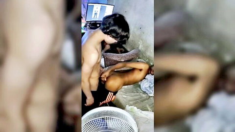 Shirtless muscular Asian gay couple embracing intimately on bathroom toilet