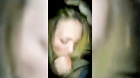 Blurry close-up of disheveled blonde woman in green top, ready to fuck