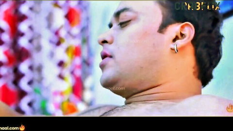 Close-up of handsome Indian man with intense erotic expression, shirtless