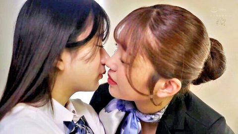 Slender Asian women kissing intimately, schoolgirl uniform and office suit