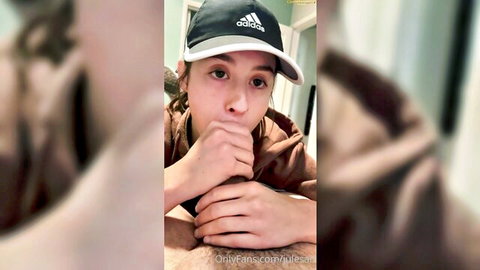 Jules Ari in Adidas cap giving blowjob to big cock, amateur oral