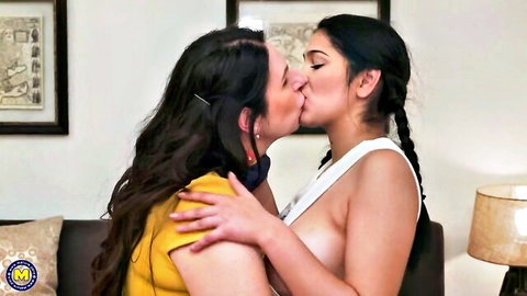 Young Latina in braids kisses busty BBW stepmom, breast exposed in lesbian scene
