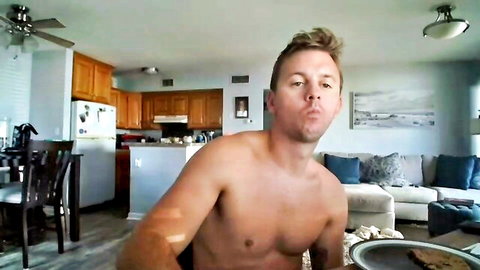 Muscular blonde hunk shirtless blowing kiss on webcam in kitchen teasing