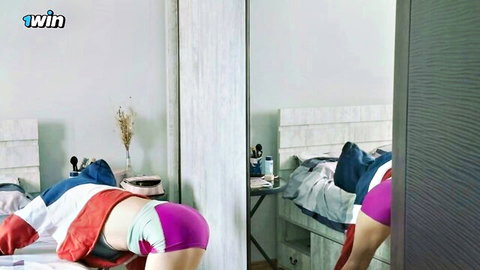 Sexy Asian woman in colorful sporty lingerie bending over, teasing ass view