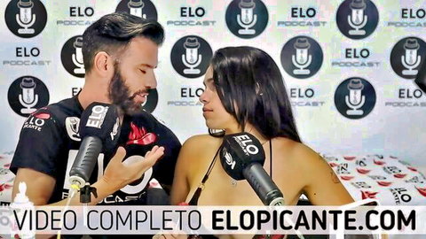 Bearded host interviews busty Latina babe in skimpy bikini top on ELO podcast