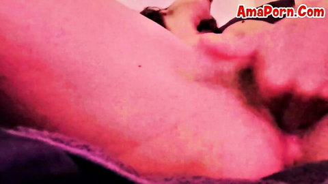 Close-up of woman spreading her pink pussy lips wide open