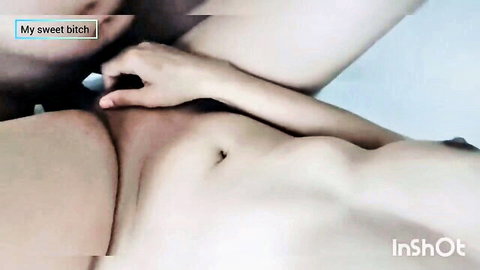Naked Arab woman lies with legs spread exposing pussy as hand fingers reach toward it