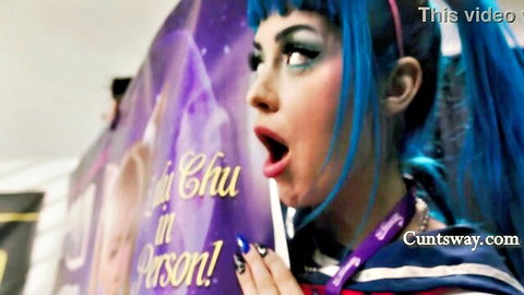 Blue-haired Asian babe Yui Chu with mouth wide open in sexy sailor costume at Cuntsway event