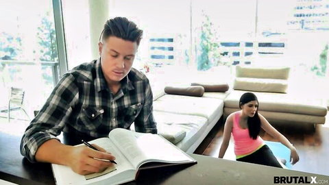Miranda Miller in pink tank top lounging on couch, guy at desk, yoga teen setup