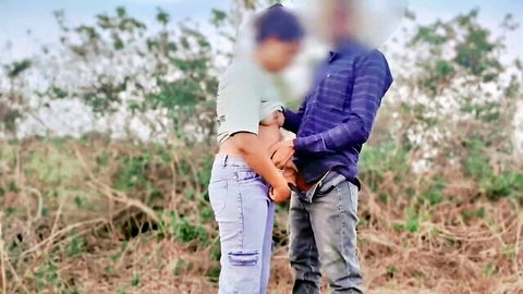 Indian college couple embracing outdoors in jungle, amateur village scene