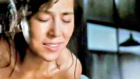 Asian beauty topless in ecstasy, eyes closed moaning intensely
