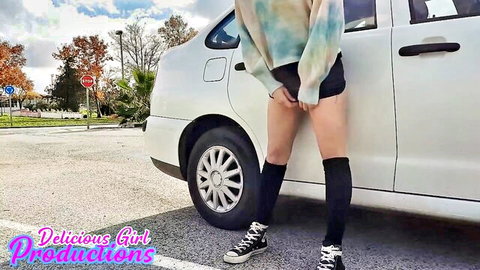 Amateur girl pulls down shorts exposing pussy outdoors in parking lot by car