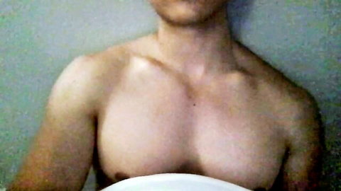 Shirtless muscular young man with toned chest and abs