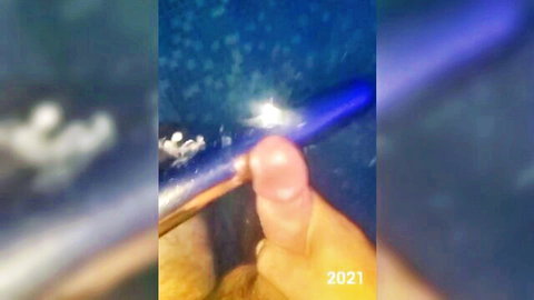 Blurry underwater close-up of erect penis in solo male masturbation