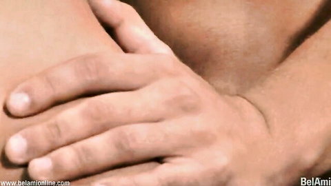 BelAmi muscular gay men embracing closely, intense eye contact