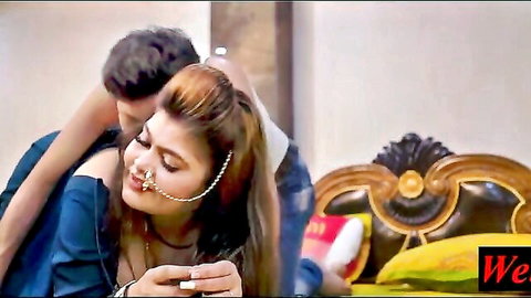 Indian college girl in intimate embrace with man, wearing nose ring and off-shoulder top