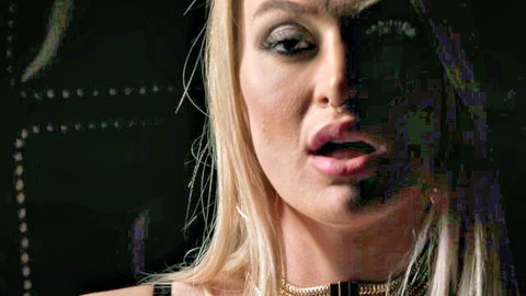Blonde bombshell puckers plump lips teasing blowjob closeup