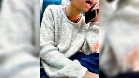 Aleena Rai young model on phone in fuzzy sweater, teasing call