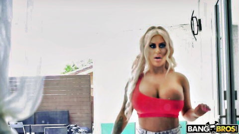 Busty blonde Brandi Bae in sexy red top outdoors