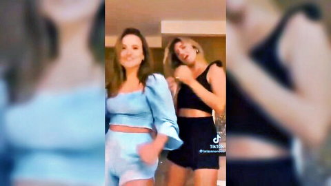 Two sexy babes dancing in crop tops and short shorts teasing curves