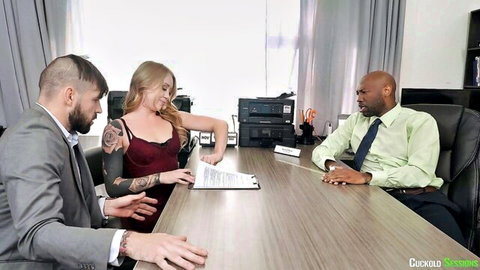 Tattooed blonde in red top discusses papers with suited boyfriend and BBC bull in cuckold office meeting