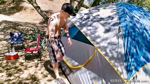 Young brunette enjoys camping sex with muscular stud outdoors