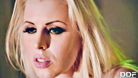 Seductive blonde babe with glossy pink lips parted in ecstasy closeup