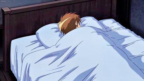 Anime boy with spiky blonde hair hiding under blue blanket in dark bedroom hentai scene