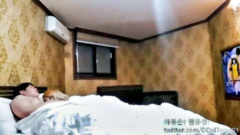 Skinny Korean blonde teen cuddling with boyfriend in bed
