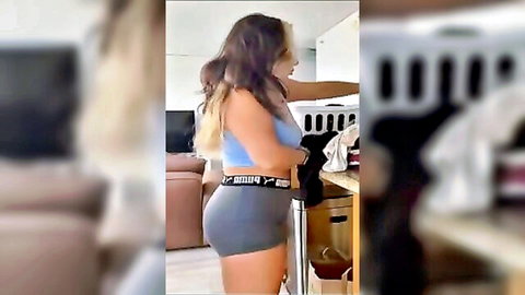 Blonde teen in tight gray shorts bending over with fat ass