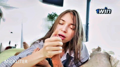 Young offended woman in striped shirt sucking finger, reluctant desire vibe