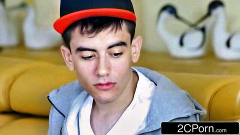 Young man in red cap and hoodie looks pensive in Rebecca More's busty stepmom seduction scene