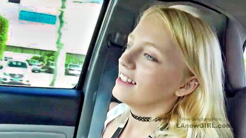 Cute blonde teen girl smiling in car wearing choker necklace