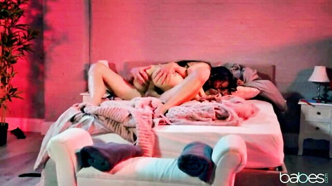 Brunette in lingerie fingers wet pussy of another sexy brunette babe on bed during hot lesbian foreplay
