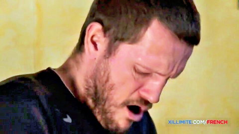 Closeup of bearded man grimacing intensely with mouth wide open during sex