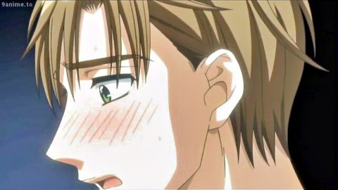 Blushing anime blonde twink with intense green eyes and flushed cheeks in gay hentai close-up