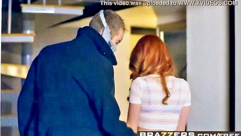 Masked older man grabs young redhead from behind in rough teasing pose