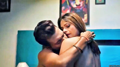 Muscular Indian man passionately kissing sexy woman's neck from behind on bed