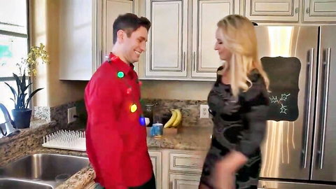 Blonde stepmom in black dress flirts with stepson in festive red sweater at Christmas party
